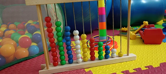 Abacus board in a colourful therapy play area